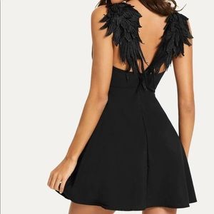 A-line breezy little black dress with black angel back detail